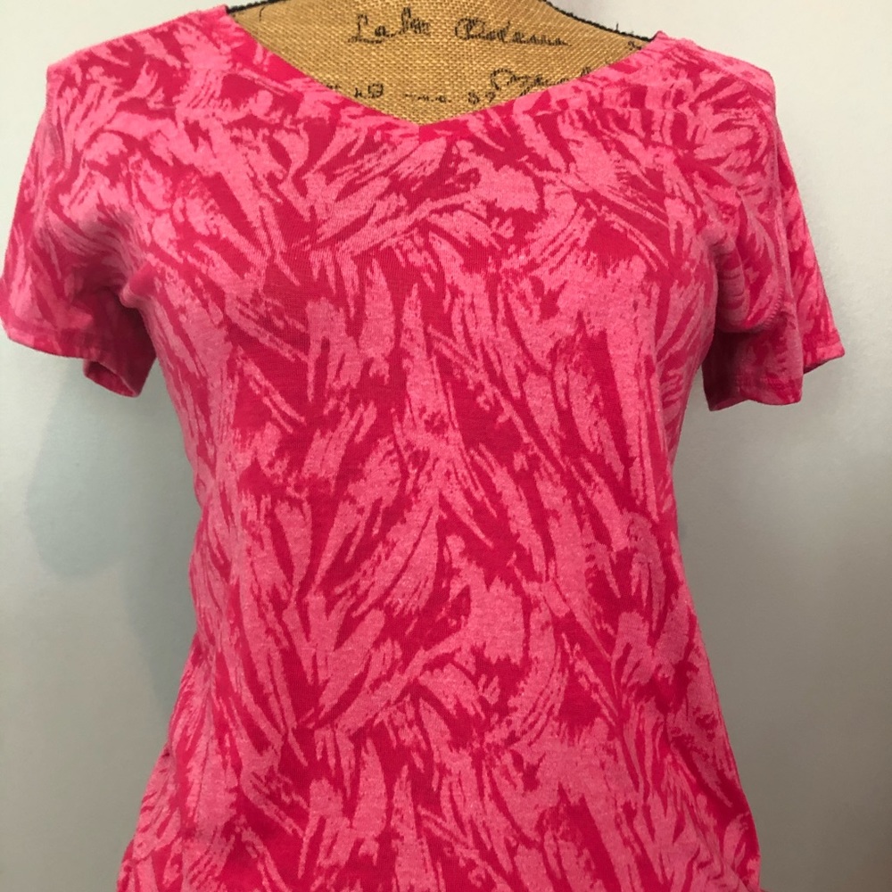 Pinks shirt with design.